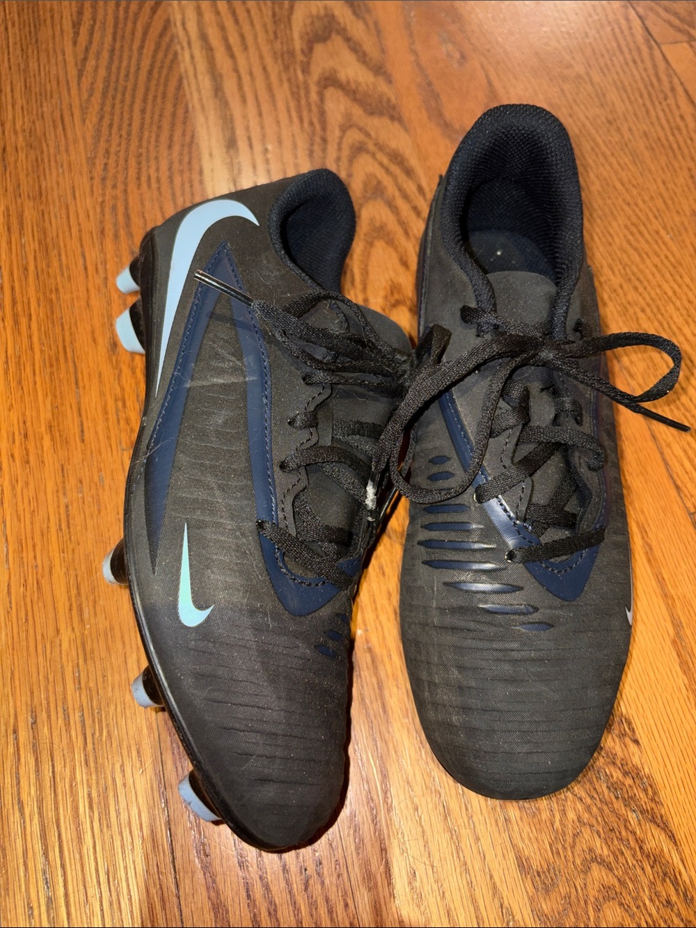 Nike cleats black with light blue